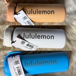 Lululemon Water Bottles in Peach, White, and Blue